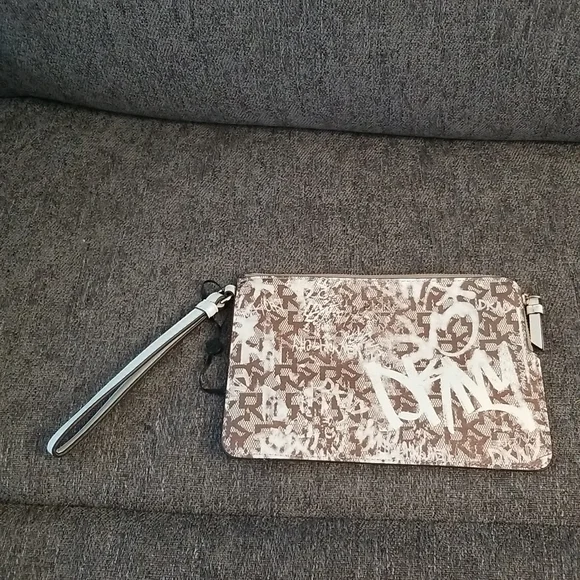 Brand new DKNY medium wristlet. Brown Graffiti pattern. Retails $78 - Picture 3 of 9